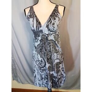 Press, Sleeveless blue dress with clear rhinestones.